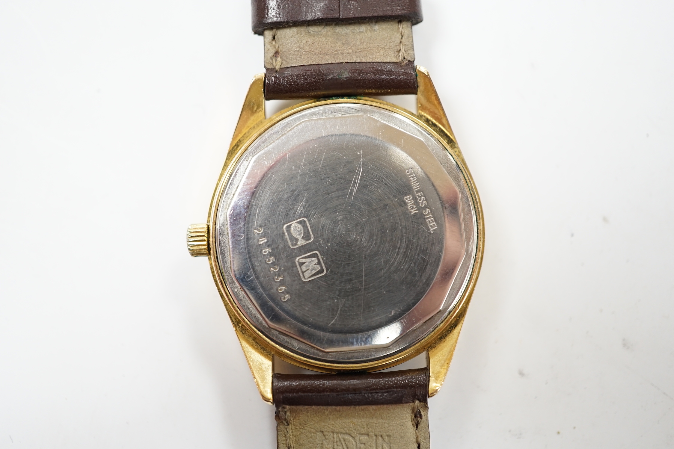 A gentleman's steel and gold plated Longines Automatic wrist watch, the dial with King Hussein of Jordan crown, on associated leather strap, with Longines box.